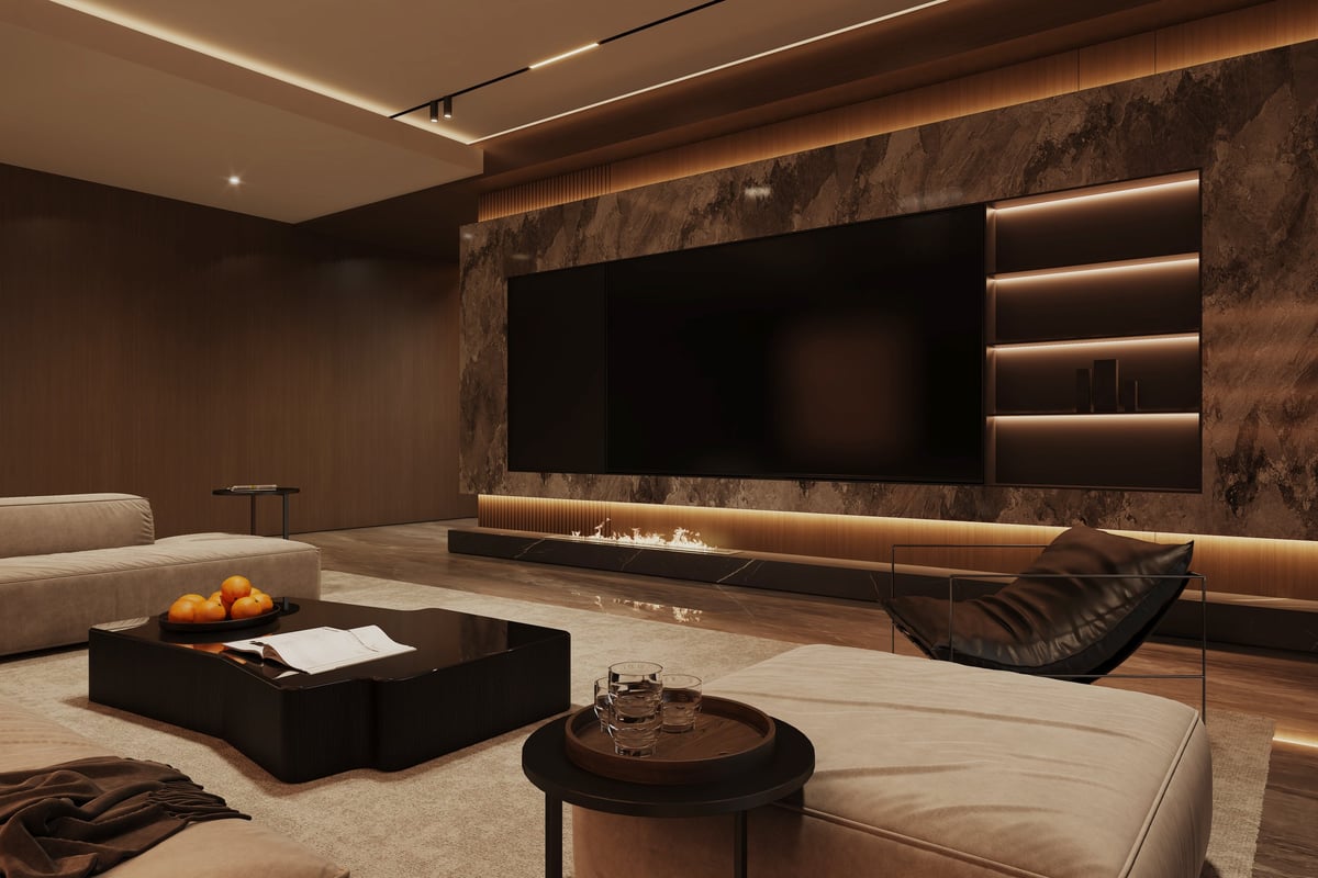 A luxurious living room focused on a feature wall with a large TV