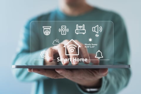 Person using a smart home system interface on a tablet
