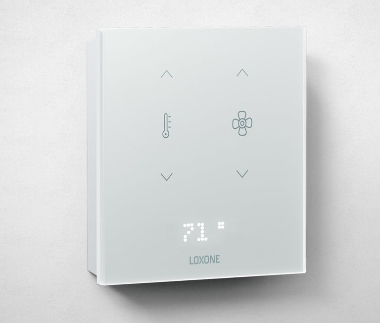 White square smart thermostat with digital display showing 71 degrees and LOXONE branding, featuring control buttons above